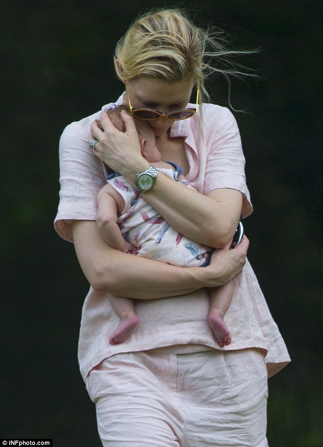 Loving arms: Cate Blanchett cradles her adopted daughter Edith after a gym class