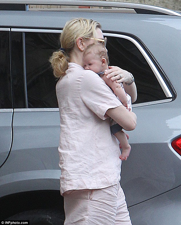 Close to her heart: The actress carried her baby girl to her car Down Under