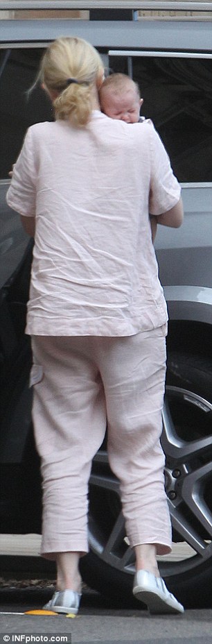 Think pink: The actress wore a pale linen top and matching trousers