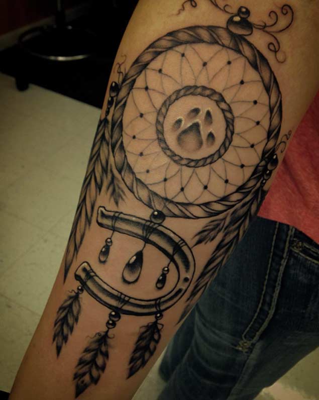 dreamcatcher arm tattoo